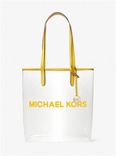 is michael kors getting away from big mk sign|The Michael Large Clear Vinyl Tote Bag .